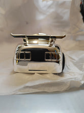 Load image into Gallery viewer, Silver-plated sports car money bank | Engraver in Canada | Gift shop in Calgary | Unique piggy bank | Automotive-inspired savings | Sleek design | Perfect for car enthusiasts | Decorative and functional | Ideal gift for all ages | Premium craftsmanship | High-quality materials | Handcrafted in Canada | Stylish home décor accent | Encourages saving habits | Adds a touch of luxury to any room | Exclusive collector's item