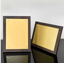 Load image into Gallery viewer, Walnut wood plaque with Gold plate screw detail
