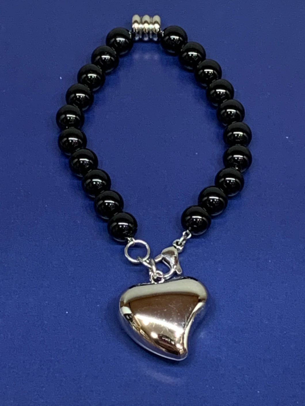 black beaded heart shaped charm bracelet 