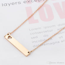 Load image into Gallery viewer, Gold stainless steel bar necklace with heart cut out
