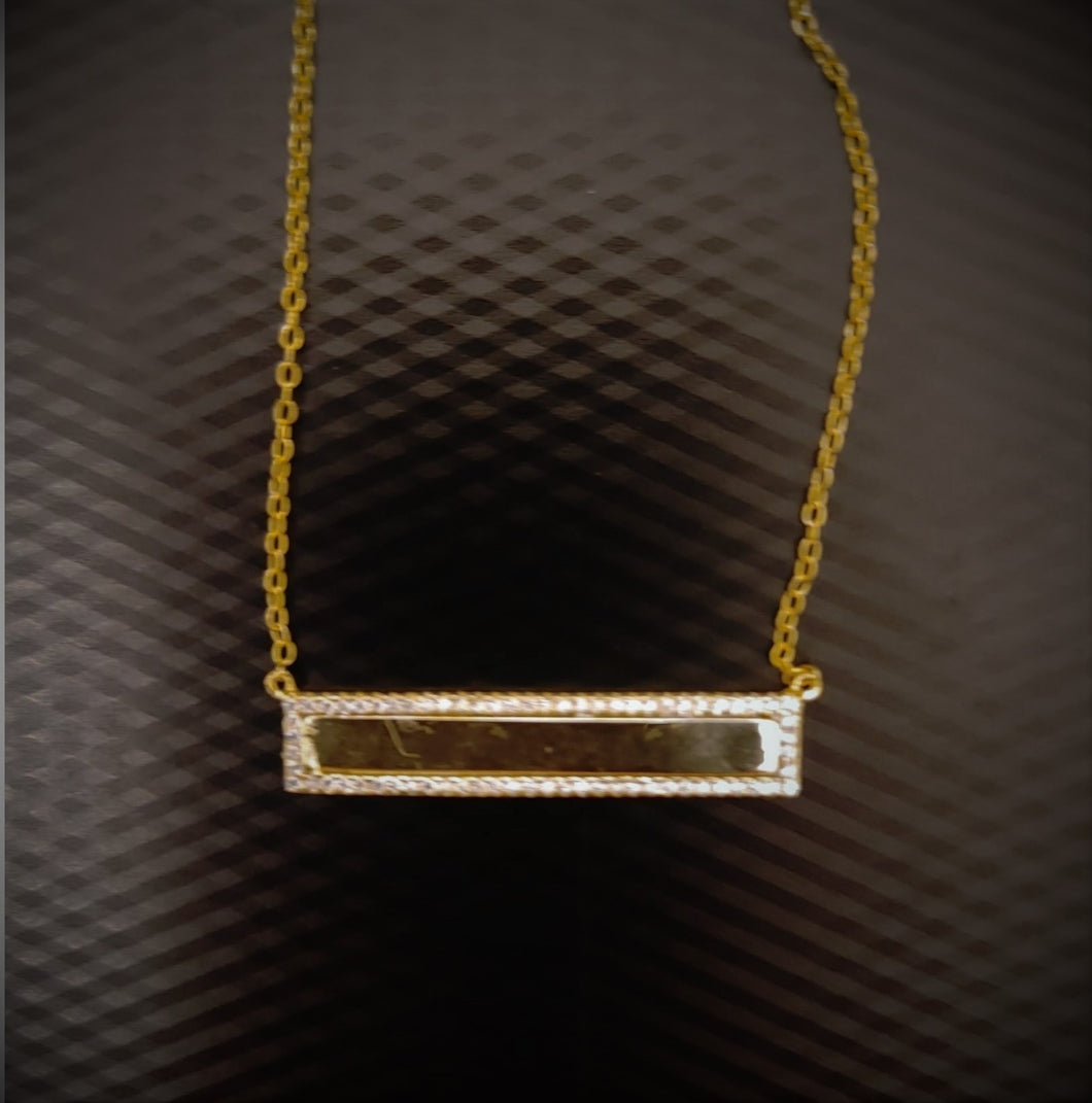 Gold bar necklace with diamond trim 