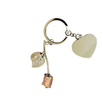 Load image into Gallery viewer, Close-up detail of rose gold rose keychain – delicate metal finish and engraved design gift idea
